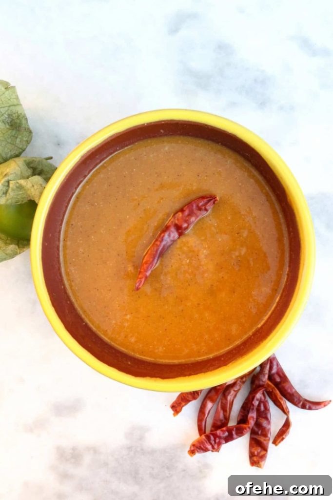 Roasted Tomatillo Salsa with Chile de Arbol Recipe 7 Roasted Tomatillo Salsa with a Chile de arbol and surrounded by more chiles and tomatillos