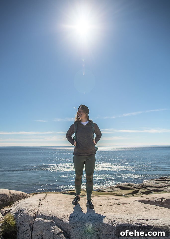 Exploring the shoreline in comfortable water shoes while visiting the Quebec coast.