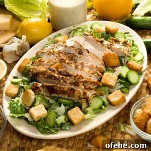Lemon Chicken Caesar Salad with Cottage Cheese Twist 9 Lemon garlic chicken caesar salad on a platter.