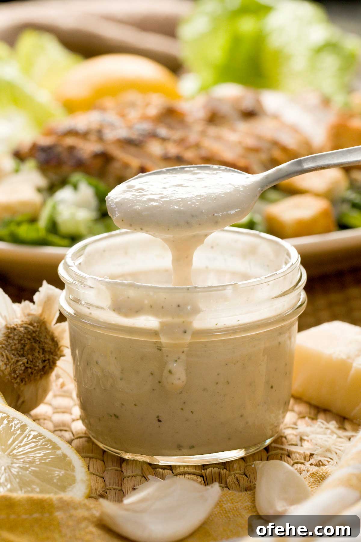 Lemon Chicken Caesar Salad with Cottage Cheese Twist 3 Lemon caesar salad dressing in a jar.