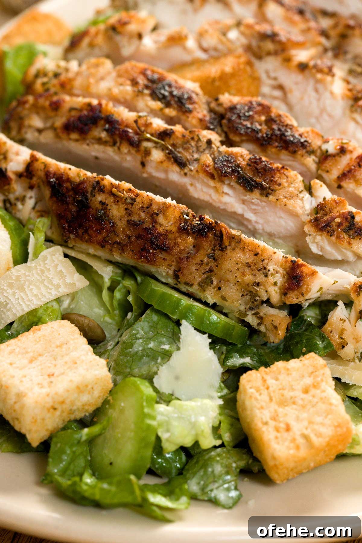 Lemon Chicken Caesar Salad with Cottage Cheese Twist 4 Lemon garlic chicken caesar salad on a platter.