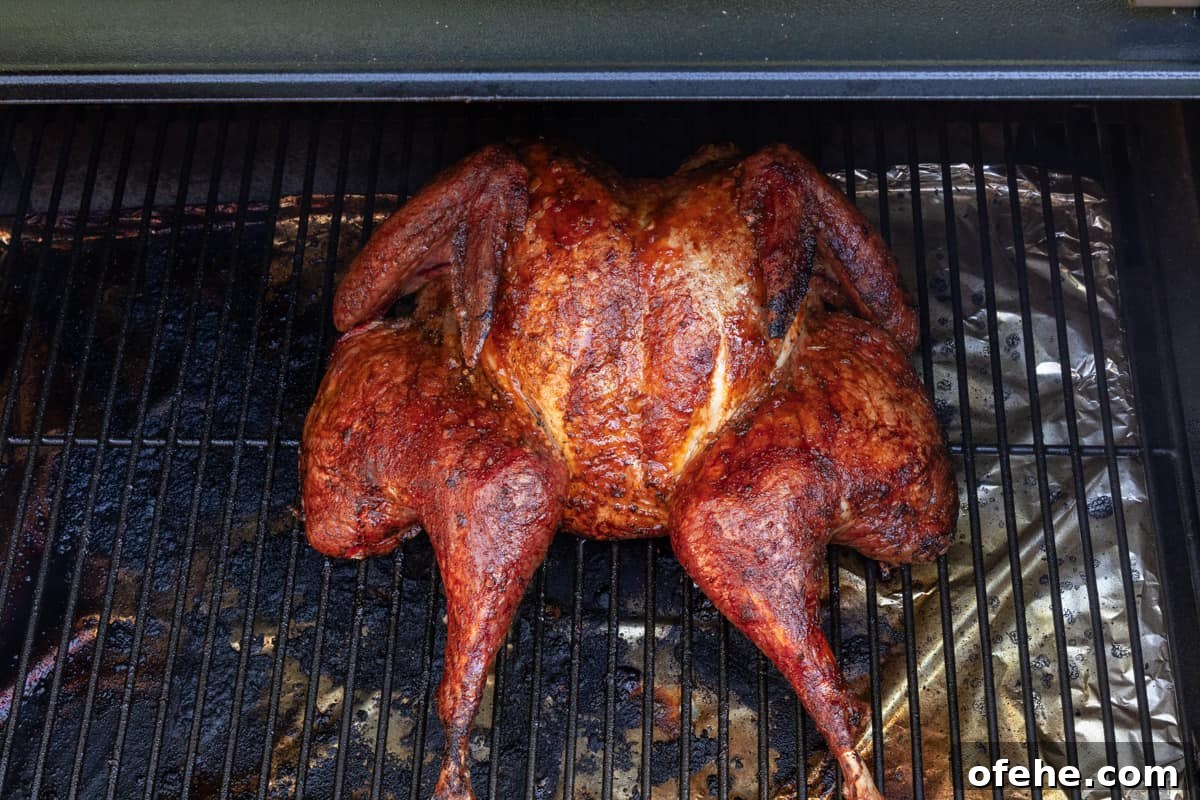 Sriracha-Glazed Smoked Spatchcock Turkey Recipe 3 Spatchcock turkey on grill rack finished smoking/cooking.