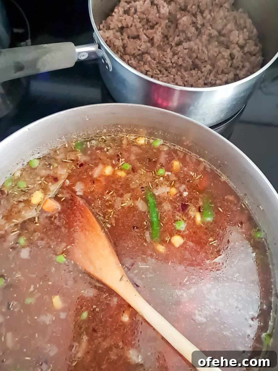Authentic Amish Vegetable Beef Soup Recipe for Comforting Meals 4 cooking the vegetables and broth in a large pot, and beef on the side.