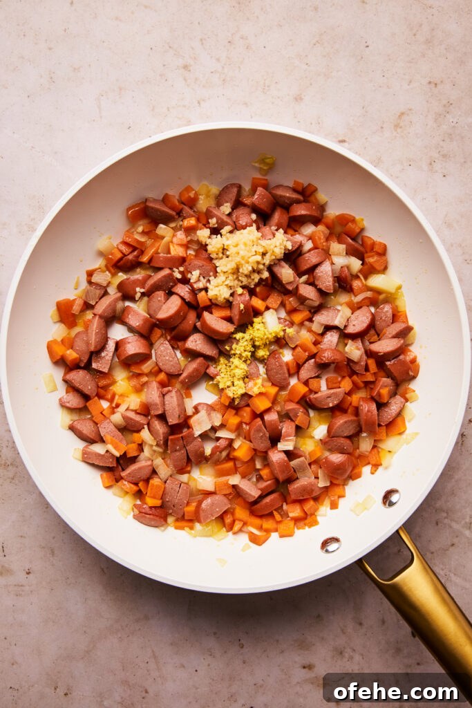 Hot Dog Fried Rice Recipe — Quick Weeknight Meal 5 hot dogs and veggies in a skillet