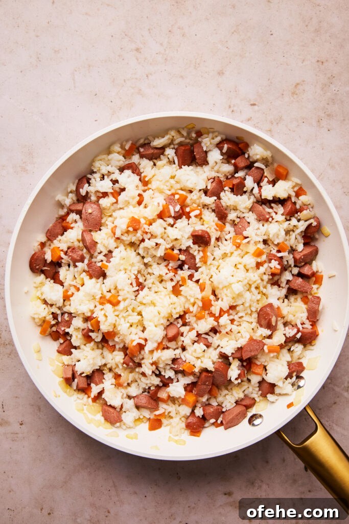 Hot Dog Fried Rice Recipe — Quick Weeknight Meal 6 rice added to hot dogs and veggies for hot dog fried rice