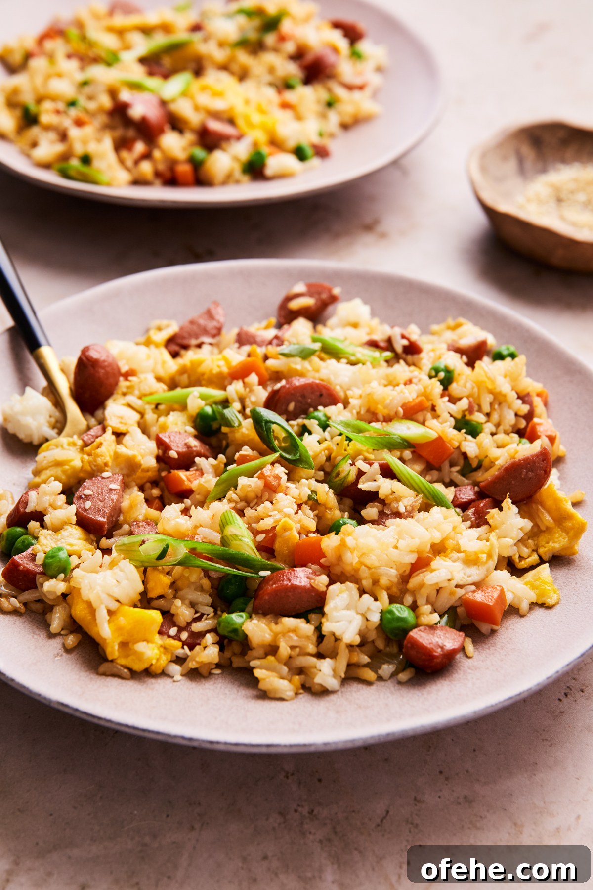Hot Dog Fried Rice Recipe — Quick Weeknight Meal 10 hot dog fried rice on a plate with a serving spoon