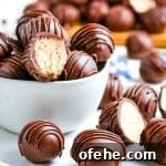Classic Old-Fashioned Peanut Butter Balls Recipe 11 Peanut butter balls stacked in a white glass bowl