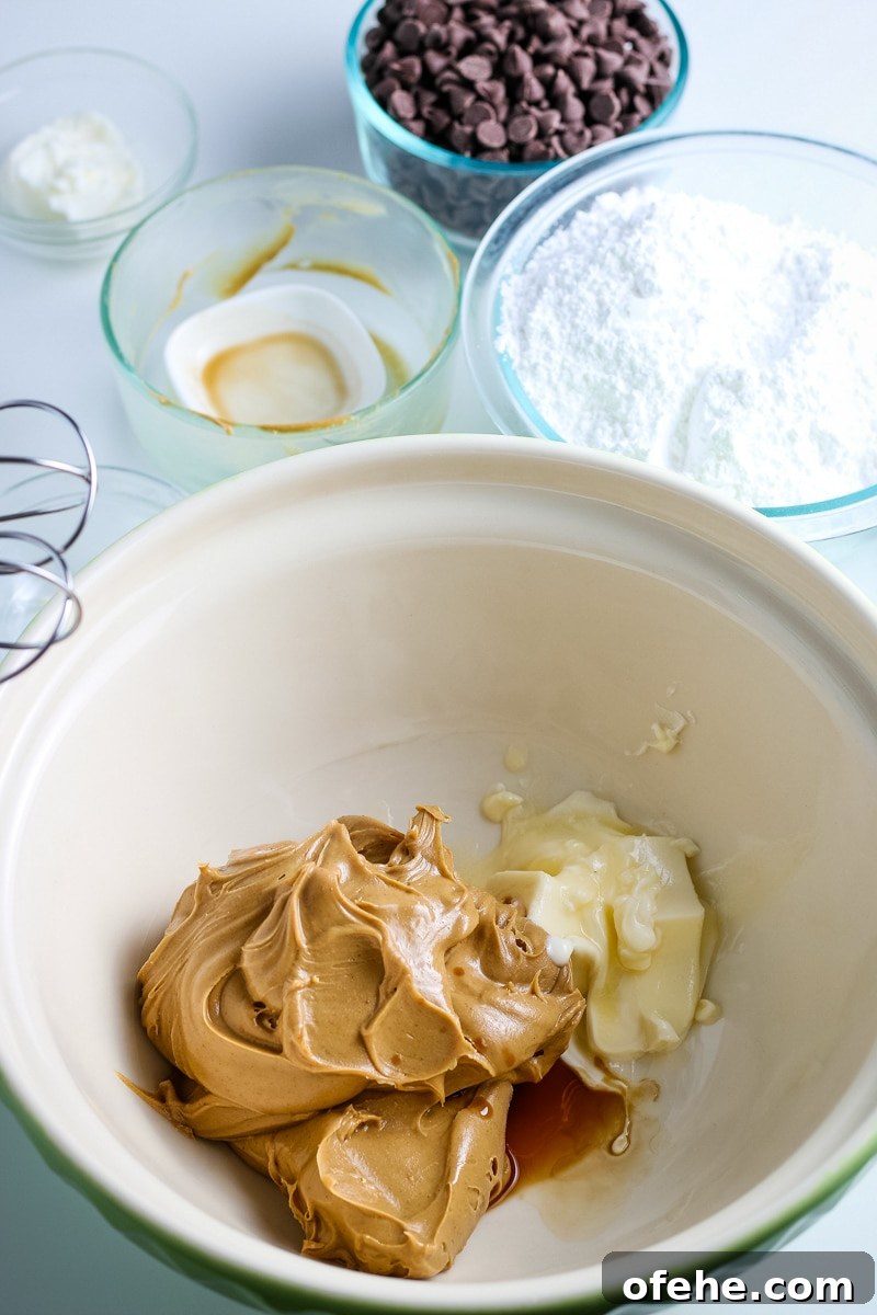Classic Old-Fashioned Peanut Butter Balls Recipe 4 creamy peanut butter and softened unsalted butter in a mixing bowl.