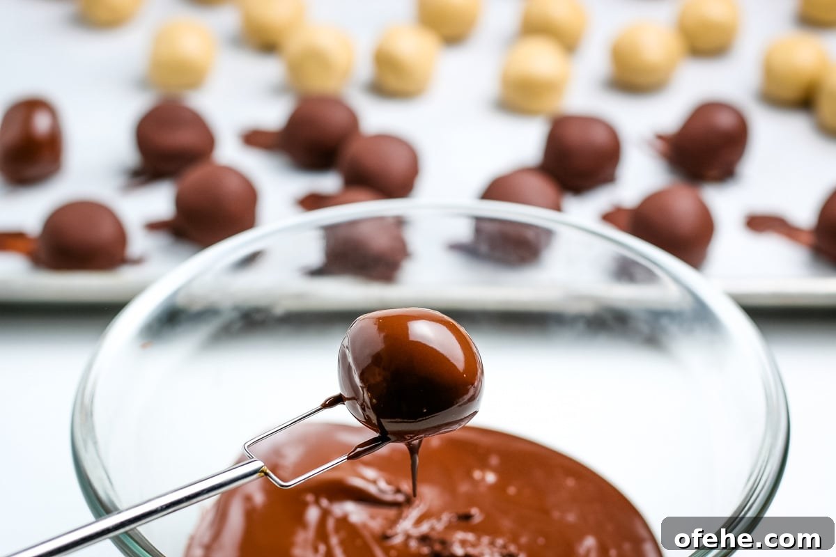 Classic Old-Fashioned Peanut Butter Balls Recipe 9 chocolate covered peanut butter ball after being dipped into the melted chocolate coating.