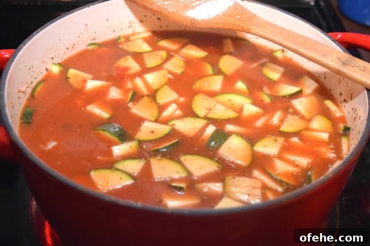 Pour in chicken broth and seasonings