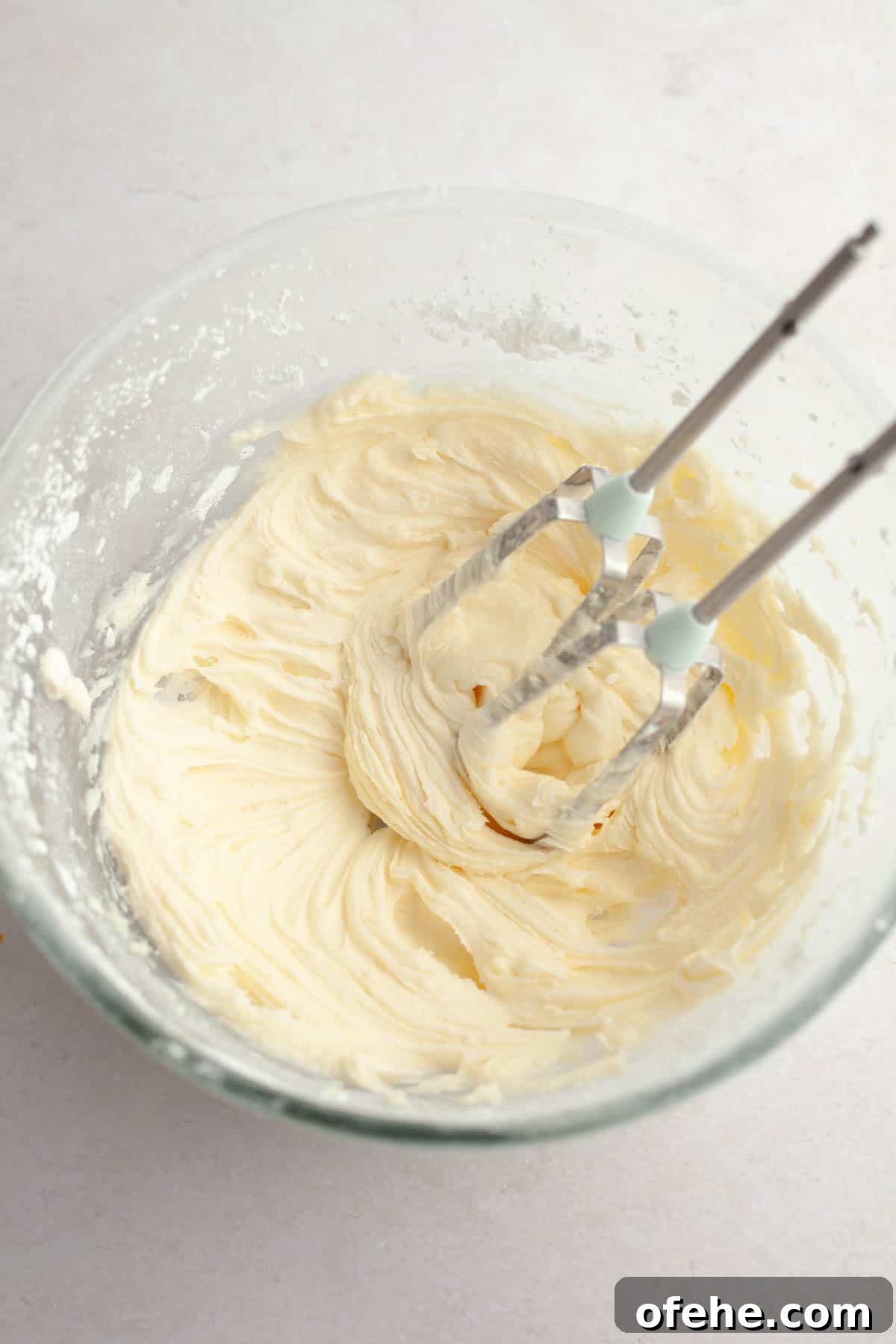 Soft Frosted Gingerbread Cookies with Cream Cheese Frosting Recipe 10 Cream cheese frosting in a bowl.