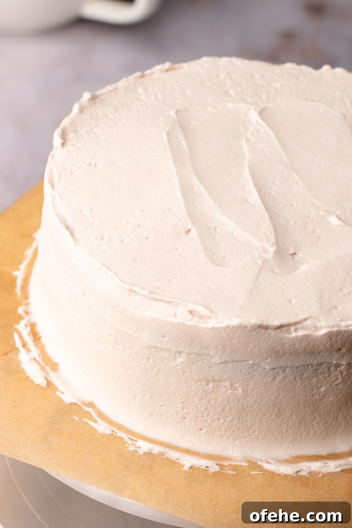 Raspberry Coconut Cake Recipe with Creamy Coconut Frosting 15 Coconut raspberry cake full frosted and smoothed out.