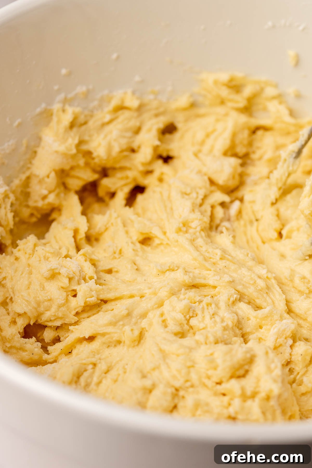 Raspberry Coconut Cake Recipe with Creamy Coconut Frosting 6 Thickened cake batter in a bowl.