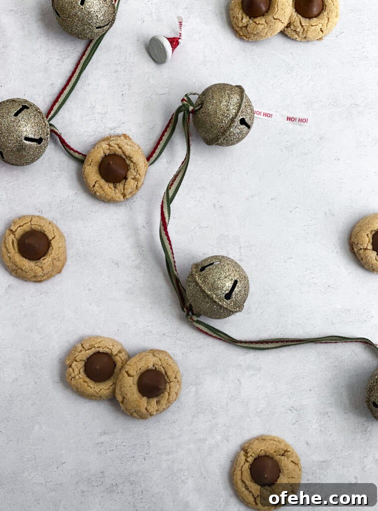 Classic Peanut Butter Blossom Cookies Recipe — Chewy & Chocolate-Topped 5 peanut butter blossom cookies scattered with bells and hershey kisses
