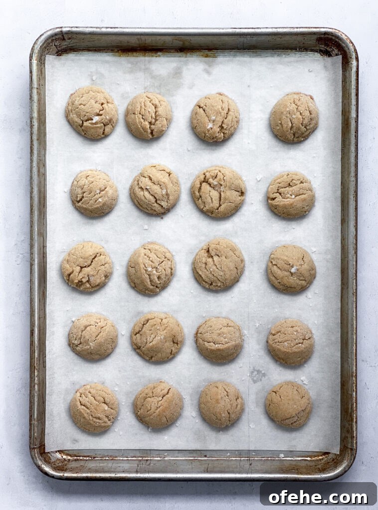 Classic Peanut Butter Blossom Cookies Recipe — Chewy & Chocolate-Topped 9 peanut butter blossom cookies out of the oven