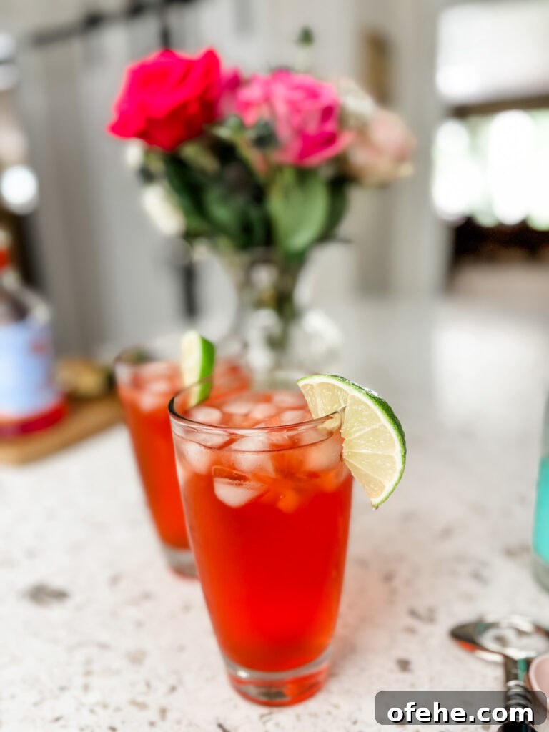 Italian Spritz Mocktail: Refreshing Non-Alcoholic Summer Cocktail 2 Two of the finished Italian Spritz mocktail garnished with a lime slice