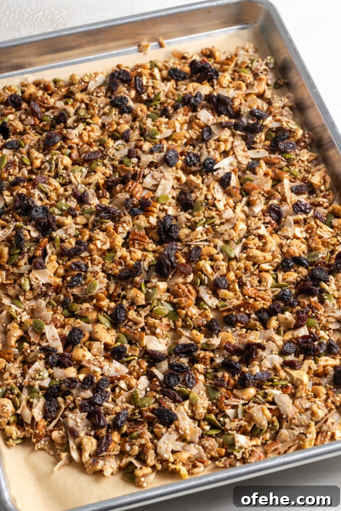 Grain-Free Homemade Granola Recipe with Crunchy Seeds 12 grain free granola on the baking sheet after mixing in the dried fruit and continuing to bake until golden and crisp.