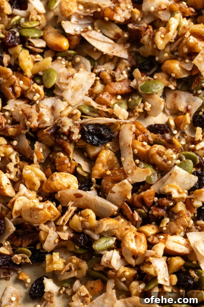 Grain-Free Homemade Granola Recipe with Crunchy Seeds 14 closeup shot of homemade grain-free granola with nuts, seeds, quinoa, coconut flakes, maple, and vanilla.
