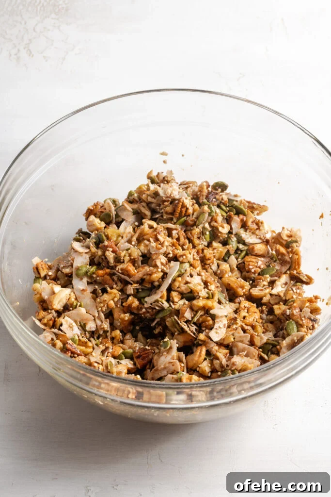 Grain-Free Homemade Granola Recipe with Crunchy Seeds 10 grain free granola mixture in a bowl after tossing with the wet ingredients.