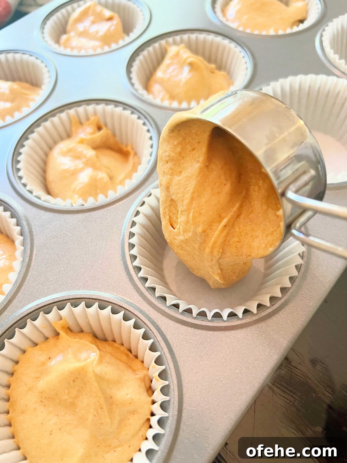 Moist Sweet Potato Cupcakes with Cinnamon Glaze 6 Filling the cupcake liners with sweet potato cake batter, using a ¼ measuring cup.