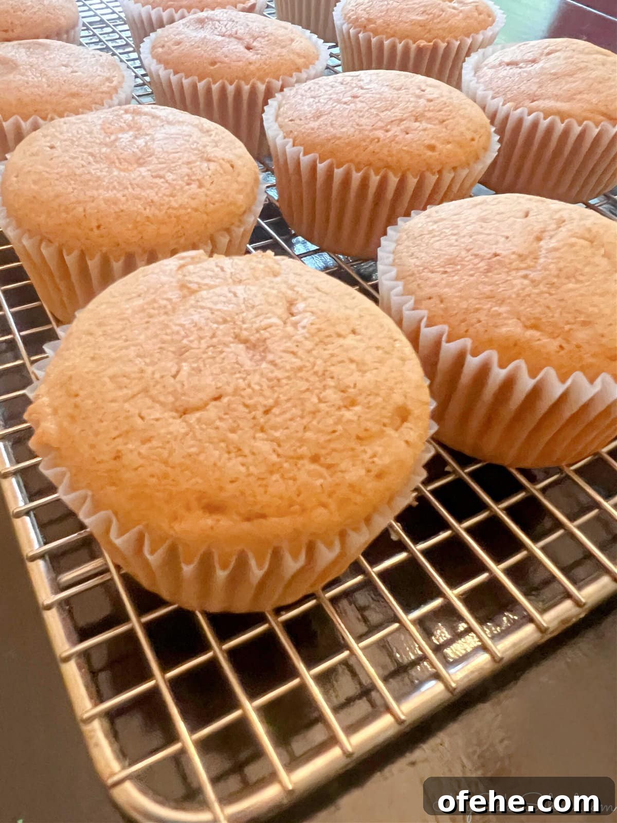 Moist Sweet Potato Cupcakes with Cinnamon Glaze 7 Sweet Potato Cupcakes on a cooling rack.