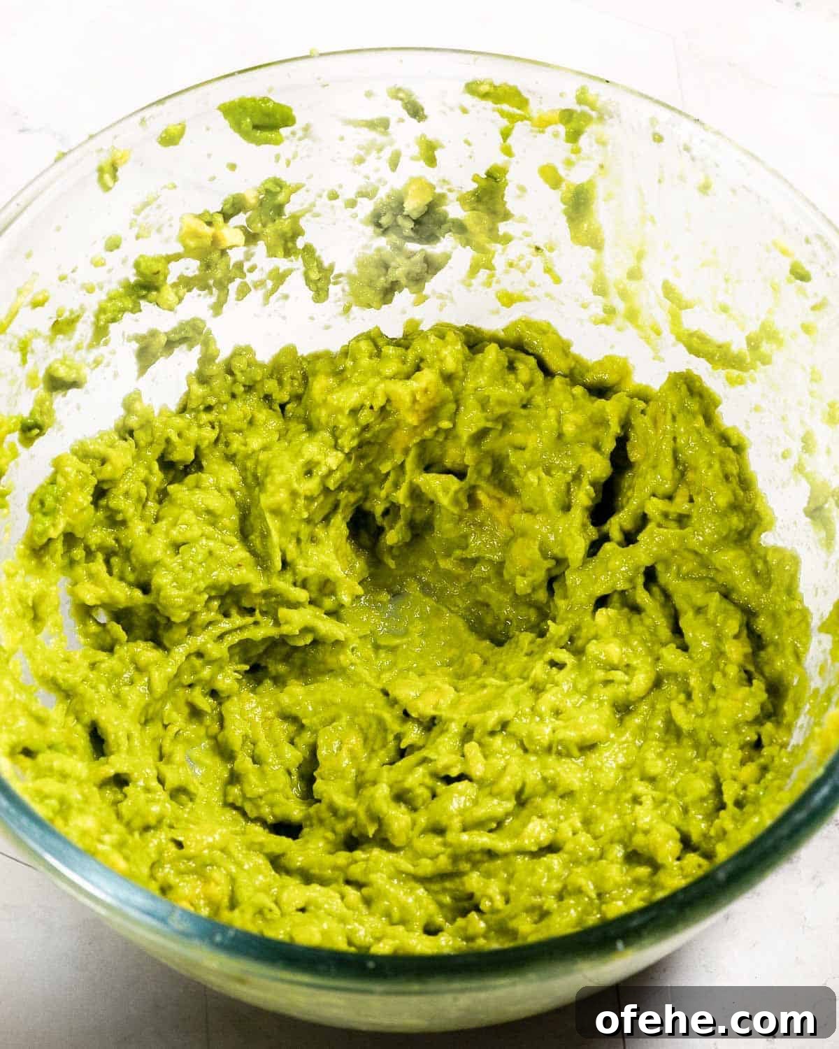 Avocado Chocolate Frosting Recipe: Creamy, Dairy-Free Chocolate Topping 4 Mashed avocado in a glass bowl.