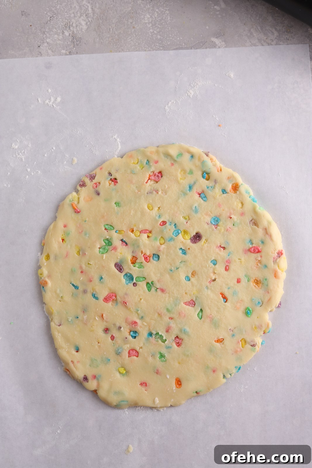 Fruity Pebbles Cookies Recipe: Colorful, Crispy Treats 6 Fruity Pebbles cookie dough rolled out on parchment paper.