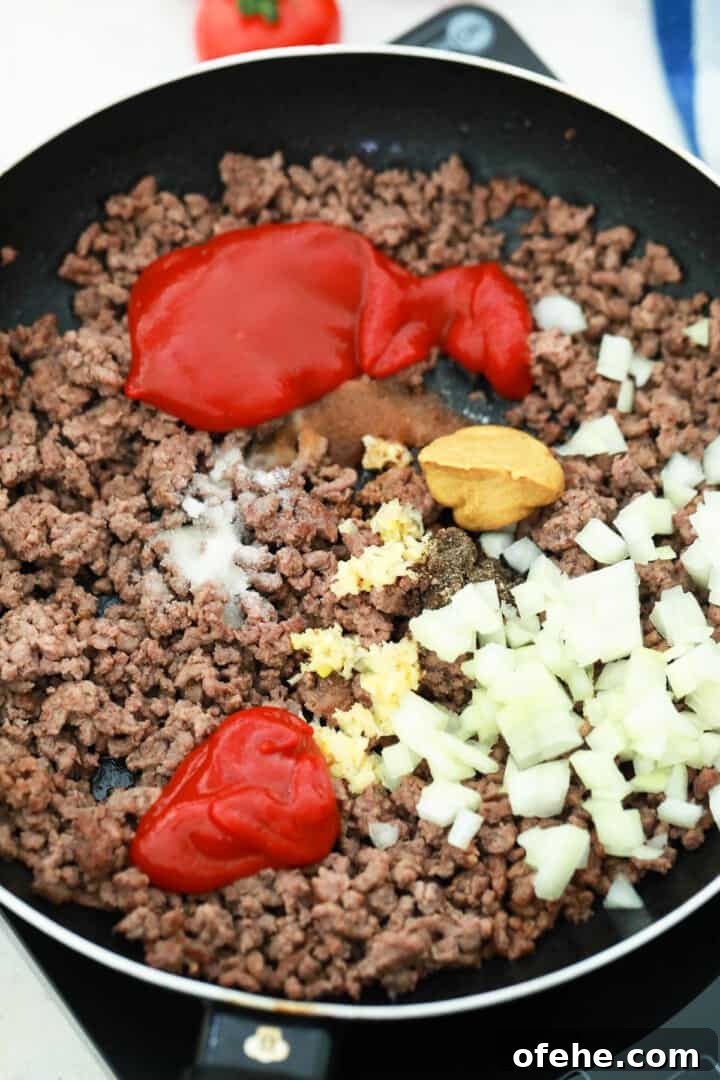 Cheeseburger Casserole Recipe: Simple Weeknight Comfort Bake 4 cooking ground beef and spices and sauces