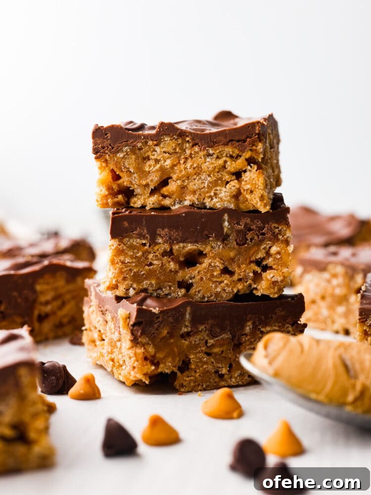 These Special K Bars are a delicious combination of smooth peanut butter, crispy Special K cereal, and a rich chocolate-butterscotch topping. This quick and easy recipe is a sweet treat that will leave you craving more. A stack of Special K bars.