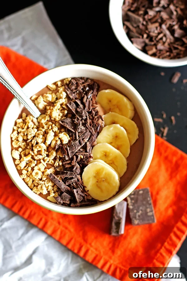 Chocolate Peanut Butter Smoothie Bowl Recipe for Breakfast Bliss 2 This Chocolate and Peanut Butter Smoothie Bowl is perfect for breakfast or an afternoon snack. Jeanniestriedandtruerecipes.com