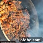 Smoked Baked Beans Smoking in a dutch oven in a smoker