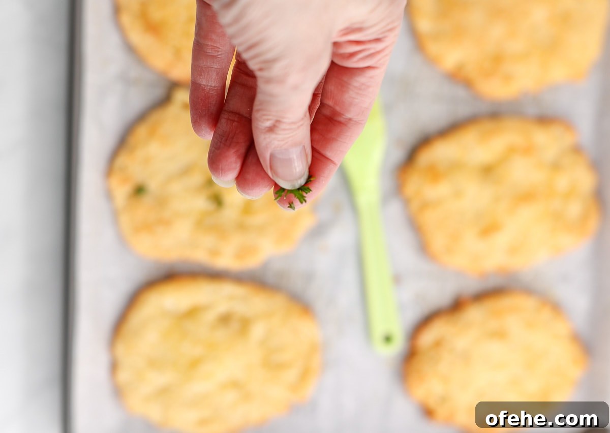 Keto-Friendly Naan Flatbread Recipe: Low-Carb Indian-Style Bread 6 Sprinkling the naan with fresh parsley.