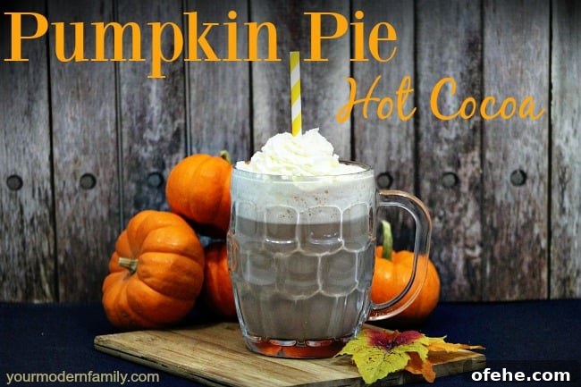 Pumpkin Pie Hot Chocolate Recipe — Cozy Spiced Drink Guide 4 A cup of Pumpkin Pie Hot Chocolate with fall themed items on the table and text above them.