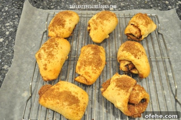 Cinnamon Roll Crescents - The Grateful Girl Cooks! Cinnamon roll crescents are baked until golden brown, then transferred to wire rack to cool.