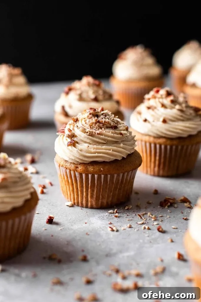 Pecan Pie Cupcakes Recipe — Classic Southern Dessert Cupcakes 2 filled and decorated pecan pie cupcakes on table