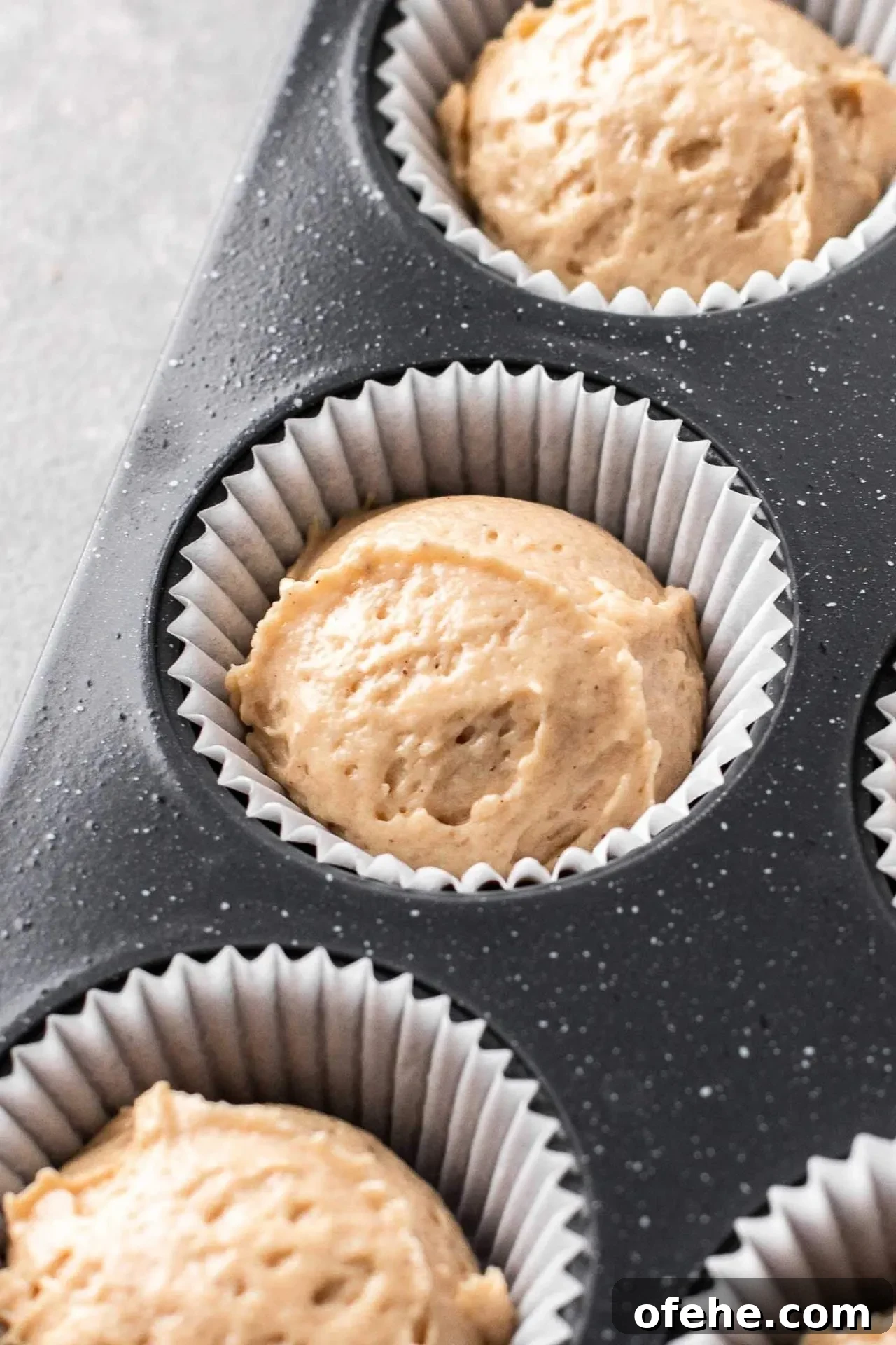 Pecan Pie Cupcakes Recipe — Classic Southern Dessert Cupcakes 10 pecan pie cupcake batter portioned into cupcake tin