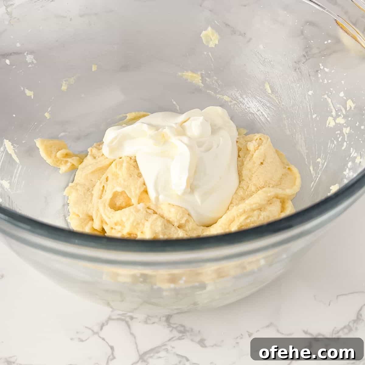 Soft and Creamy Sour Cream Cookies Recipe 5 Adding the sour cream to the wet ingredients.