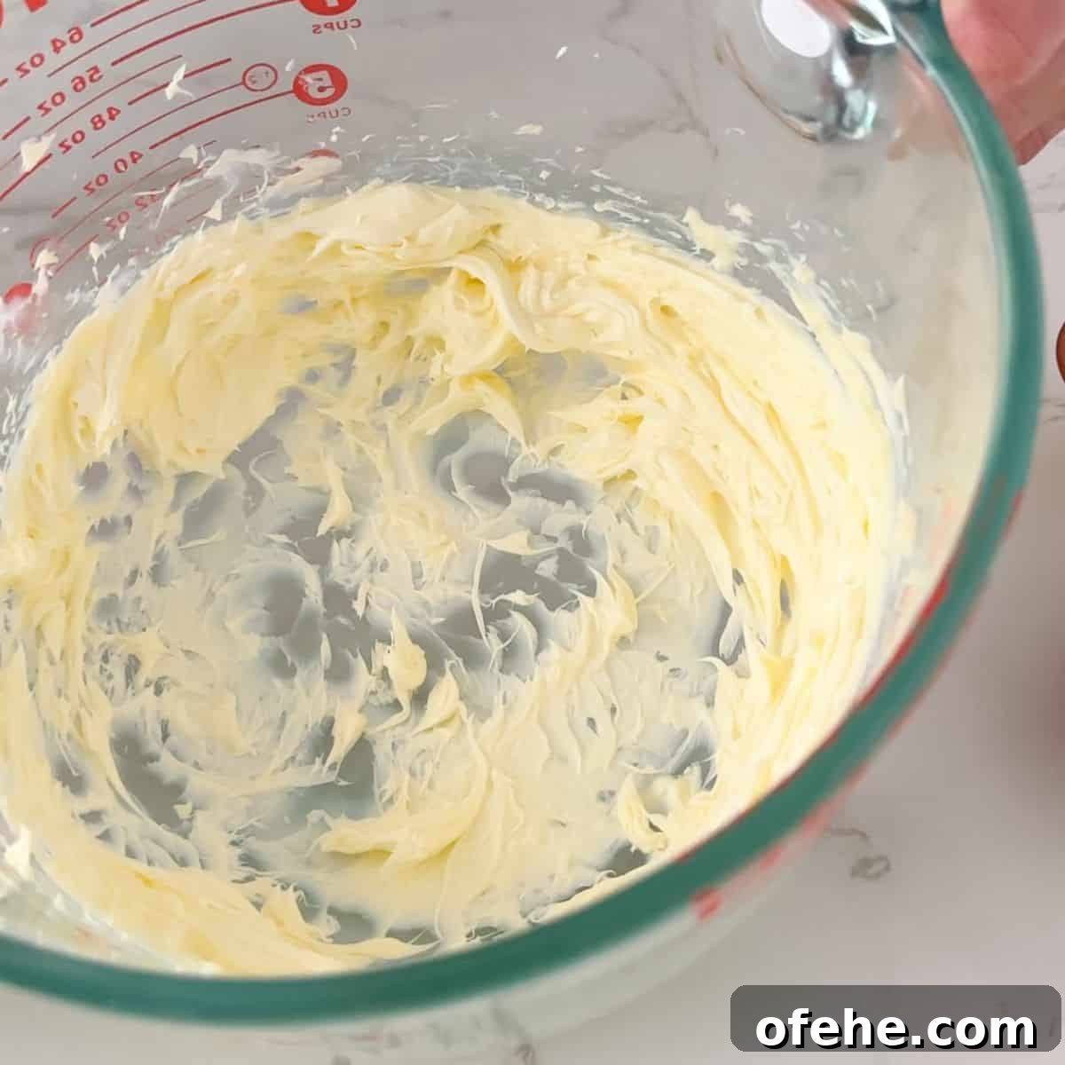 Soft and Creamy Sour Cream Cookies Recipe 8 Creaming the butter for frosting.
