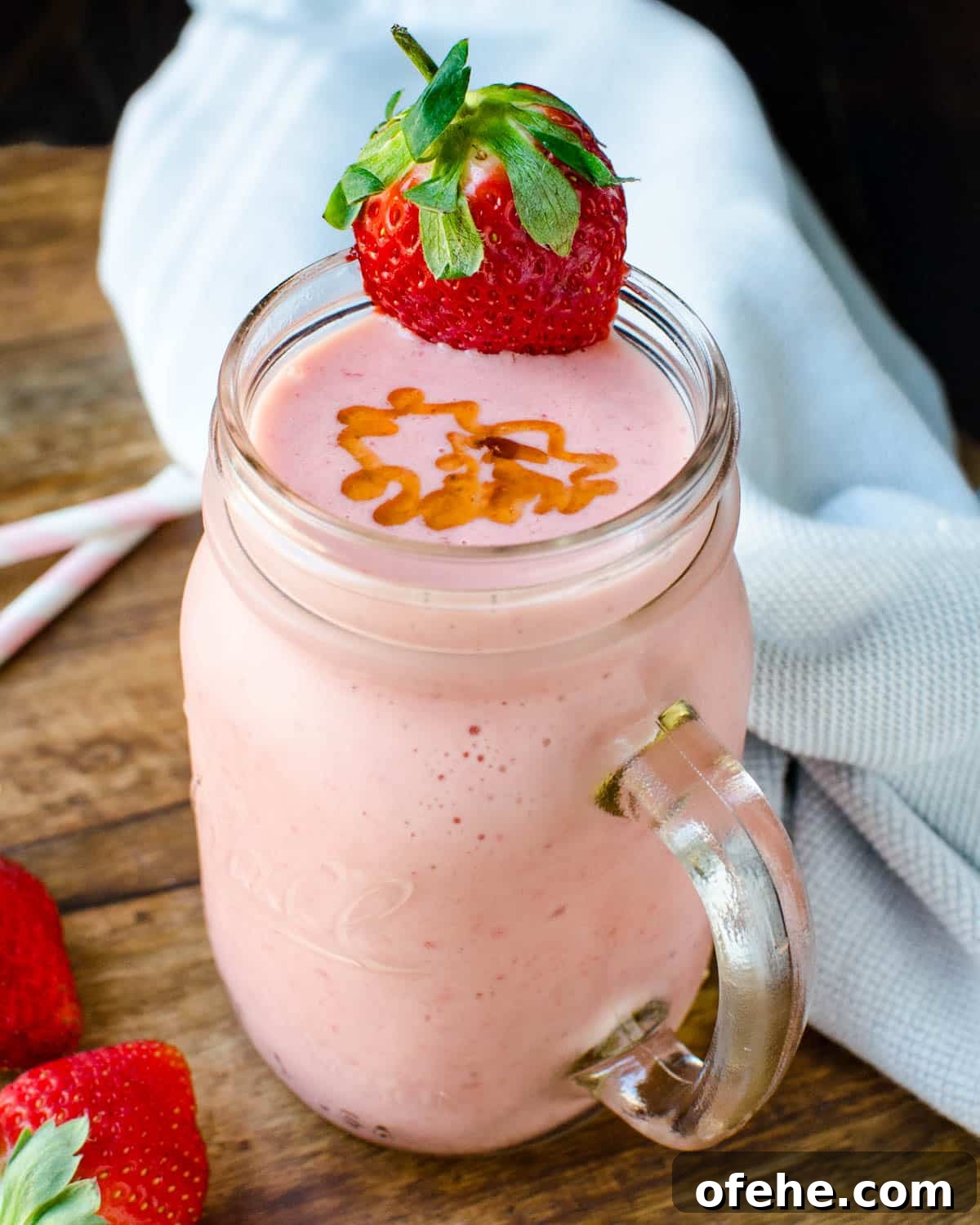 Strawberry Orange Banana Smoothie Recipe for Fresh Morning Energy 6 strawberry orange banana smoothie with a honey garnish.
