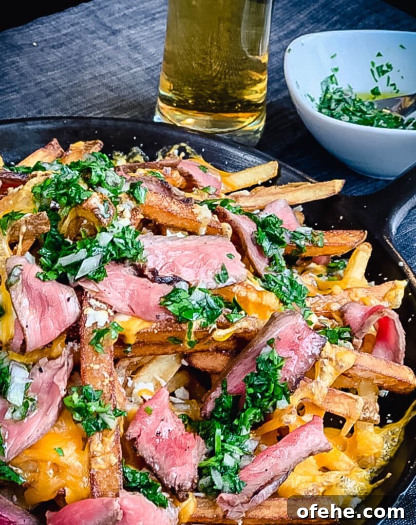 Loaded Fries (Frachos) Recipe: Ultimate Nacho-Style Topping Guide 2 steak frachos with chimichurri and beer