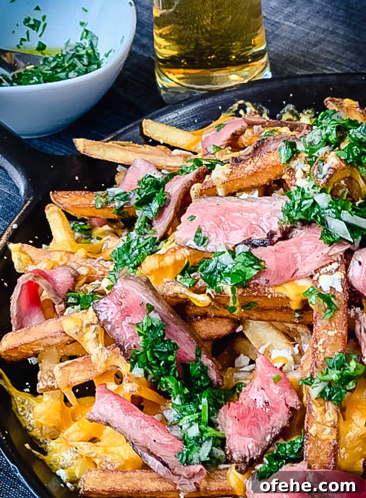 Loaded Fries (Frachos) Recipe: Ultimate Nacho-Style Topping Guide 10 steak frachos on a cast iron dish