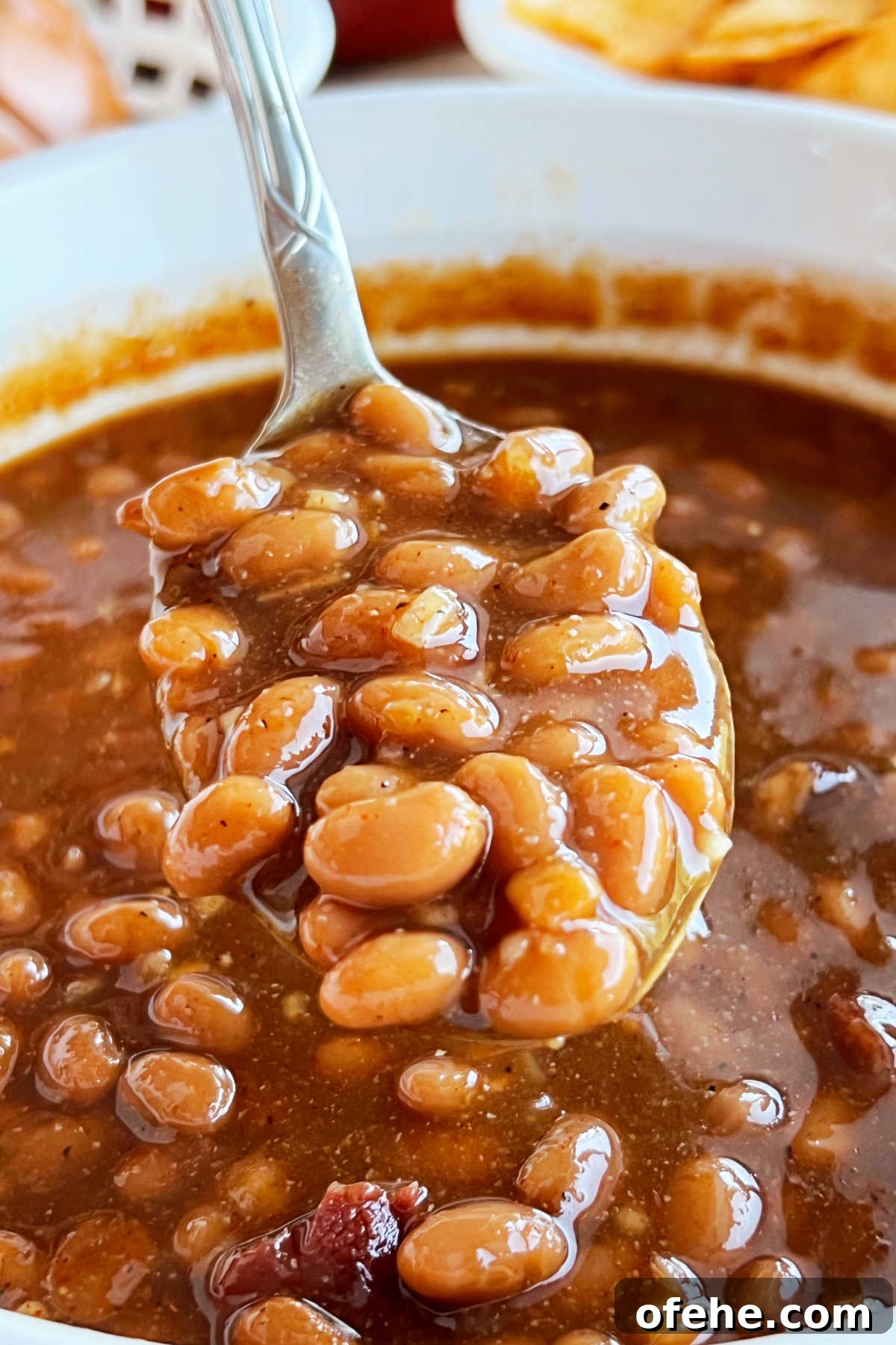 easy brown sugar baked beans on a serving spoon