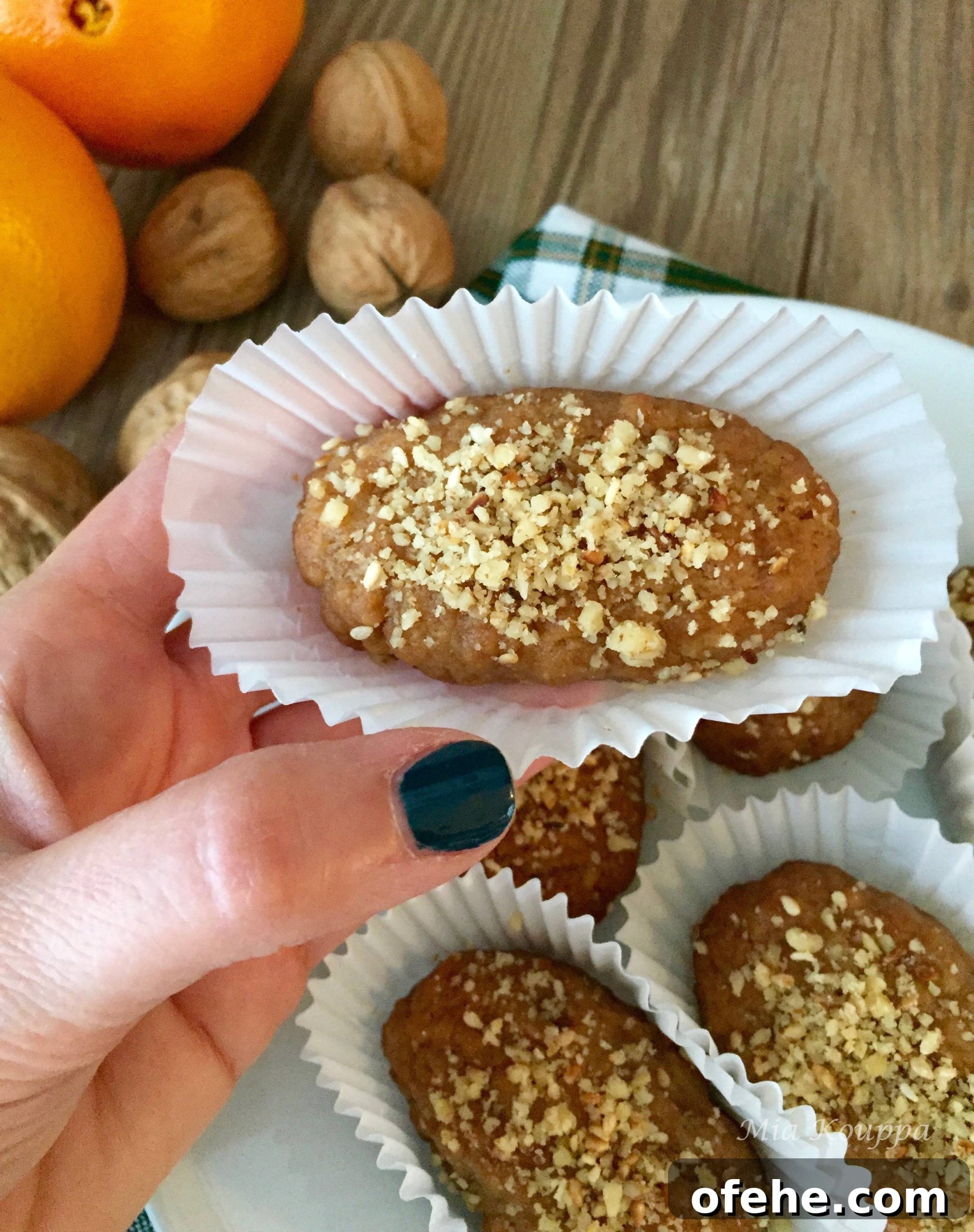 Melomakarona Greek cookies. These deliciously spiced, honey soaked, walnut topped Greek cookies just melt in your mouth.