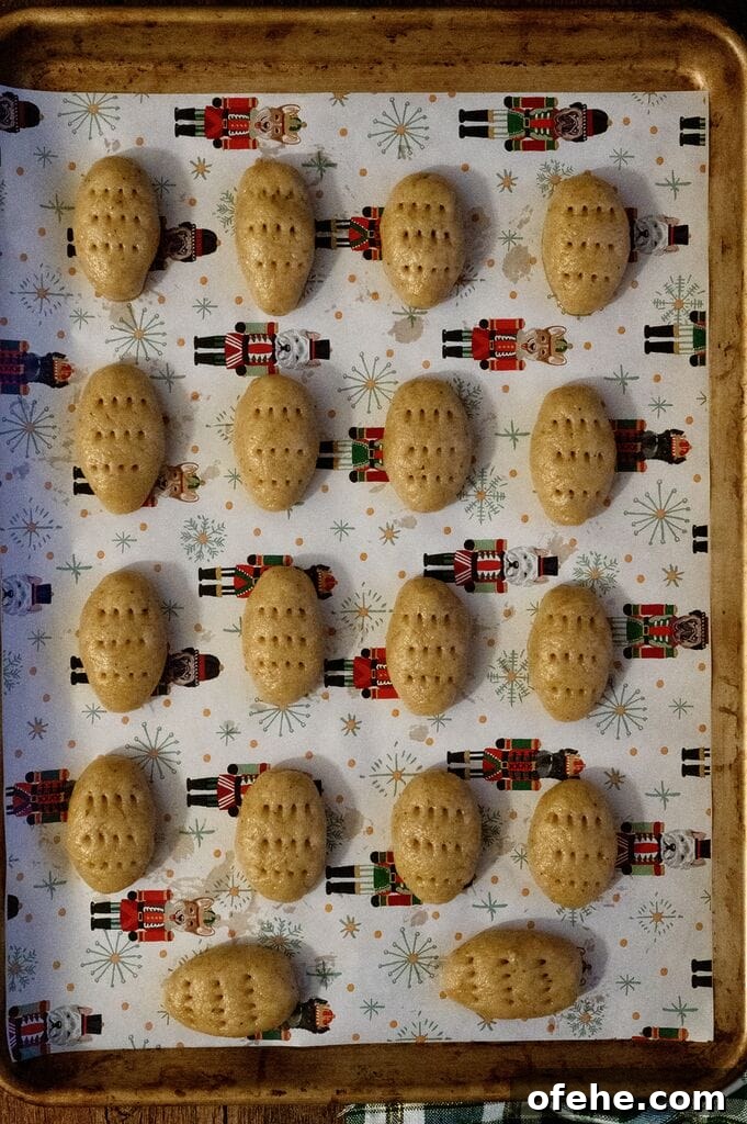 Melomakarona, ready to bake, on a baking tray