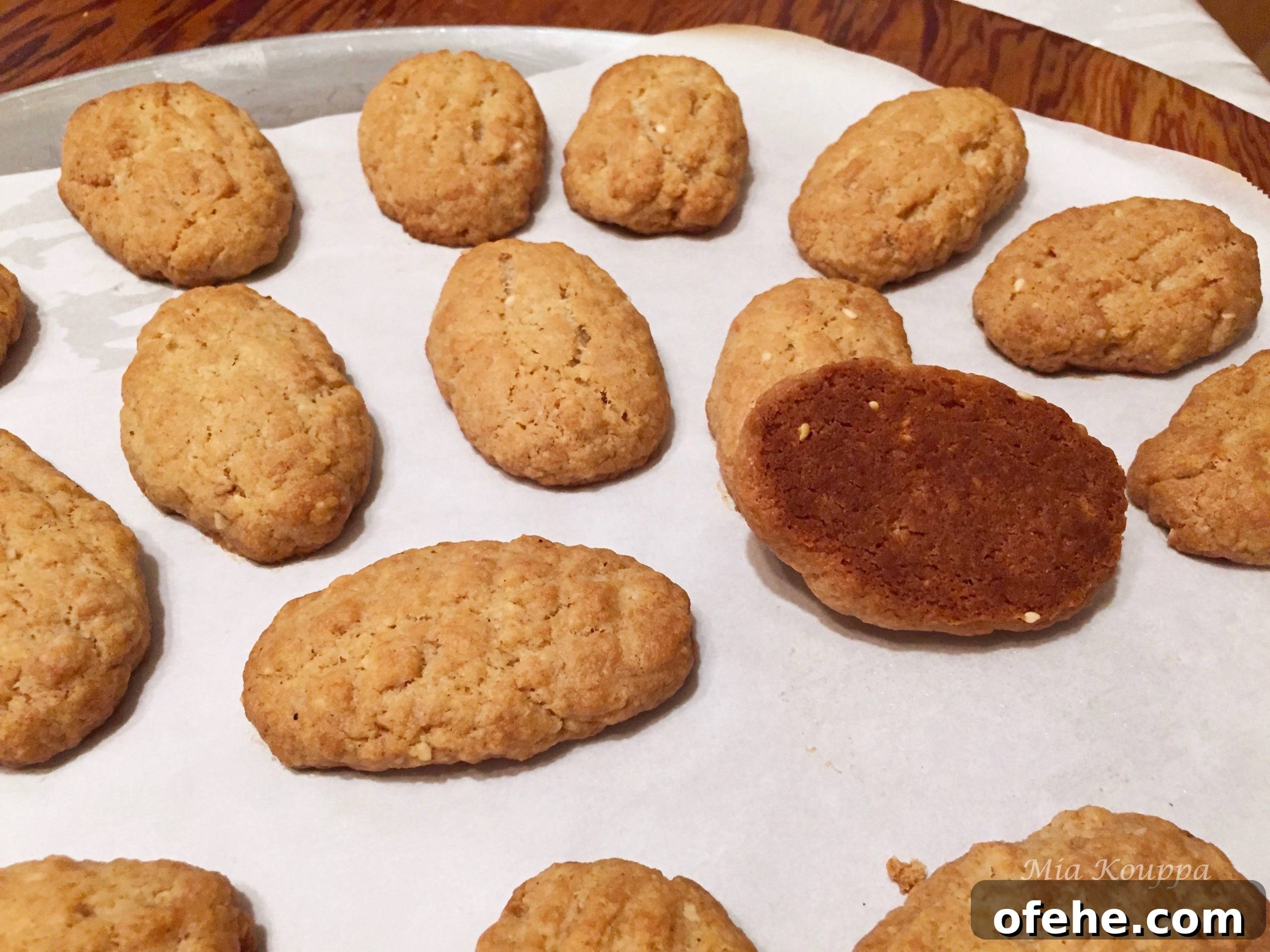 Melomakarona Greek cookies. These deliciously spiced, honey soaked, walnut topped Greek cookies just melt in your mouth.