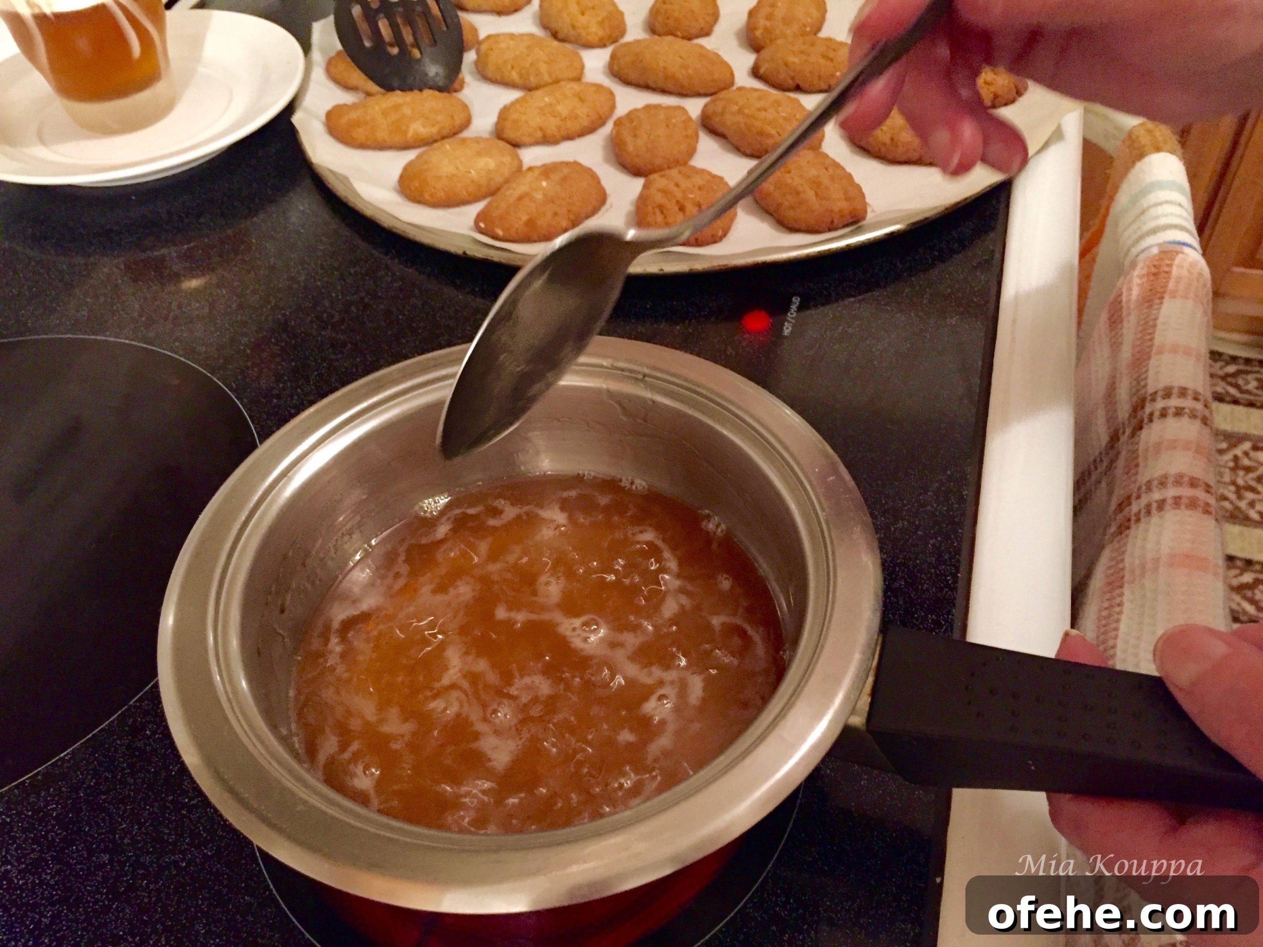Melomakarona Greek cookies. These deliciously spiced, honey soaked, walnut topped Greek cookies just melt in your mouth.