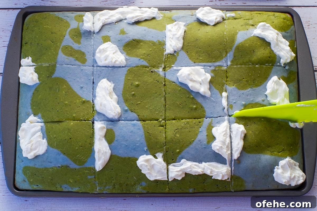 Colorful Earth Day Sheet-Pan Pancakes Recipe 16 Earth Day Sheet Pan Pancakes with some whipped cream on them, c