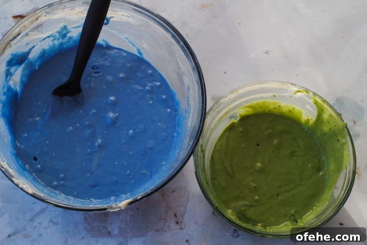 Colorful Earth Day Sheet-Pan Pancakes Recipe 10 Blue batter in large glass bowl and green batter in smaller glass bowl.
