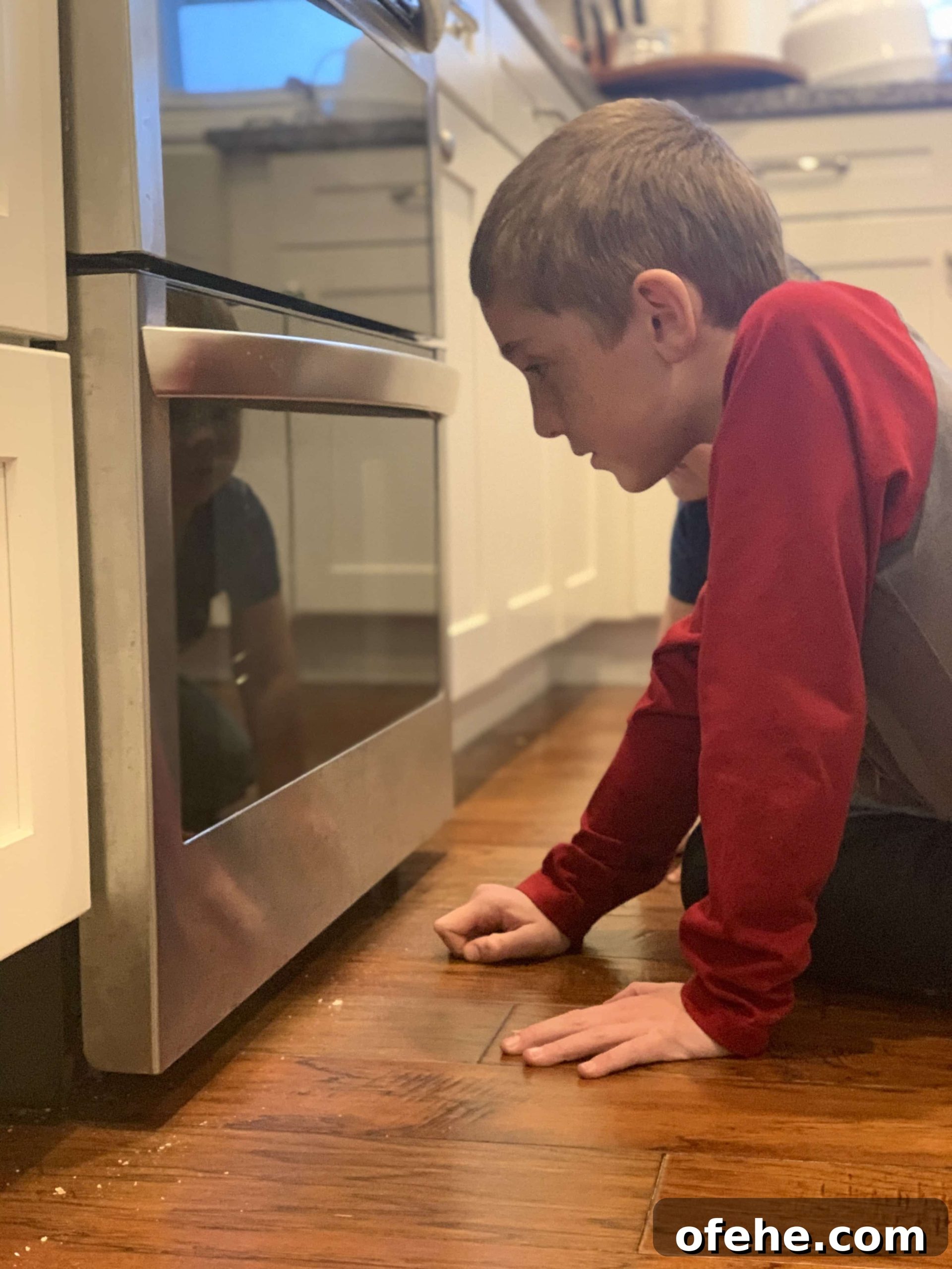 Watching their pizzas bake