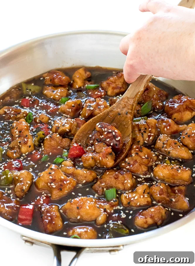 Homestyle Sweet and Sour Chicken with Tangy Pineapple Sauce 6 chicken in skillet with wooden spoon